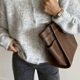 Vintage lysegrå strikvest med muslingeknapper