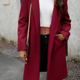 Lang, ensfarvet frakke i uldblanding