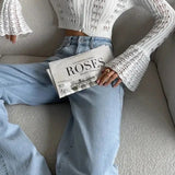 Langærmet vest i åbent strik med V-hals