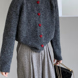 Oversized cardigan med hjerteformede knapper og rund hals