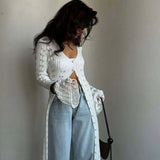 Langærmet strandvest med svaj i strik