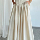 Elegant trapeznederdel med høj talje og flæser, bælte og sidelommer