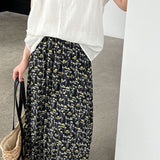 Højtaljet plisseret nederdel med retro blomsterprint