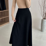 Vintage højtaljet maxinederdel i tekstureret strik