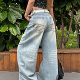 Højtaljede jeans med brede ben og broderi