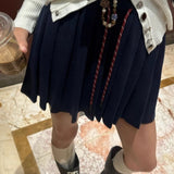 Plisseret mini-nederdel i strik