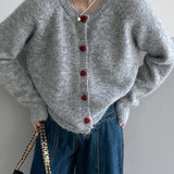 Oversized cardigan med hjerteformede knapper og rund hals