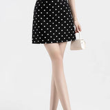 Trapeznederdel med polkaprikker