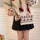 Oversized vest med pomponer