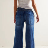 Jeans med elastisk linning med mellemhøj talje, rynkede ben og vide ben