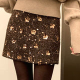 Kort, højtaljet A-formet nederdel med pailletter