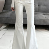 Hvide jeans med lav talje og bootcut-stræk