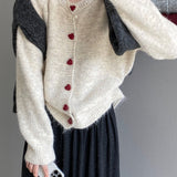 Oversized cardigan med hjerteformede knapper og rund hals