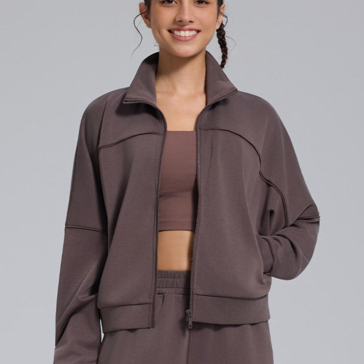 Løstsiddende sportsvest med lynlås til udendørs yoga, lange ærmer