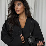 Todelt sæt: ensfarvet V-hals cardigan med tilspidsede ben