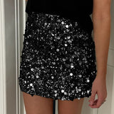 Mini bodycon-nederdel med pailletter forneden