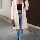 Lang, ensfarvet frakke i uldblanding