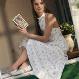 Todelt sæt: vest og maxinederdel med satinprint og pufkant