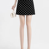 Trapeznederdel med polkaprikker