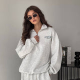 Todelt sæt: hættetrøje med print og halv lynlås og bukser med vide ben og lige ben