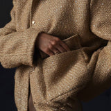 Paillettejakke med høj krave og lommer