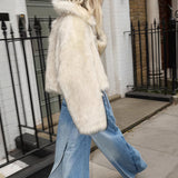 Kort quiltet frakke i imiteret rævepels