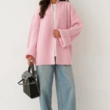 Komfortabel og afslappet strikvest med bundet talje.