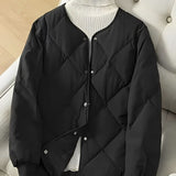 Elegant, alsidig og komfortabel sort quiltet jakke til kvinder