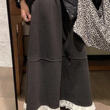 Højtaljet, lang nederdel med flæser i uldblanding