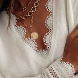 Langærmet bluse med blondeindsatser