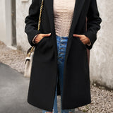 Lang, ensfarvet frakke i uldblanding