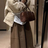 Højtaljet, lang nederdel med flæser i uldblanding