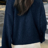 Minimalistisk cardigan med lange ærmer og knapper