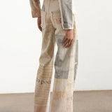 Lige jeans trykt med vintage avispapir