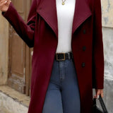 Mellemlang, enkeltradet frakke i en uldblanding