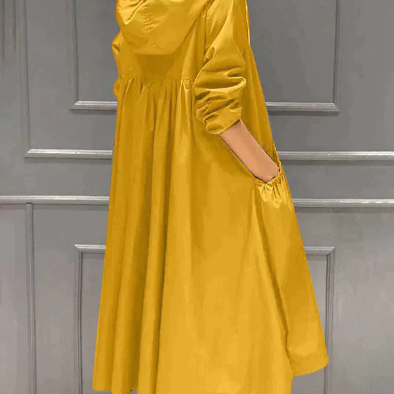 Vandtæt damejakke – Afslappet pasform – Knælang – Hætte – Lange ærmer – Funktionelle lommer – Lynlåslukning