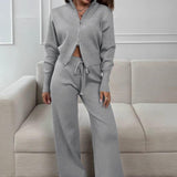 Todelt, tætsiddende striksæt med tovejslynlås for komfort på farten