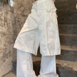 Butterfly, imiteret jakkesæt og løse hvide jeans i 2000'er-stil