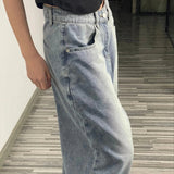 Jeans med brede ben og indadvendte lommer