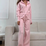 Todelt, tætsiddende striksæt med tovejslynlås for komfort på farten