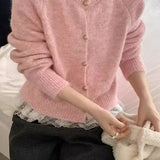 Løs og blød cardigan i ensfarvet strik