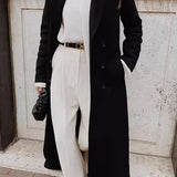 Lang frakke i ensfarvet uldblanding