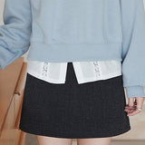 Ensfarvet tartan-mønster nederdel