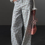 Lyseblå jeans med blomsterprint, højtaljede og vide ben