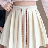 Plisseret mini-nederdel i strik