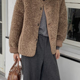 Vendbar pelsfrakke med bløde reverser