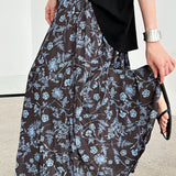 Højtaljet plisseret nederdel med retro blomsterprint