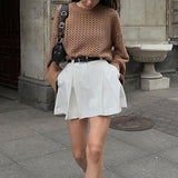 Højtaljet hvid plisseret mini-nederdel