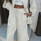 Todelt sæt: bukser og snørebukser i abrikosfarvet bomuld til kontoret