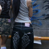 Lige jeans broderet med englevinger og rhinsten